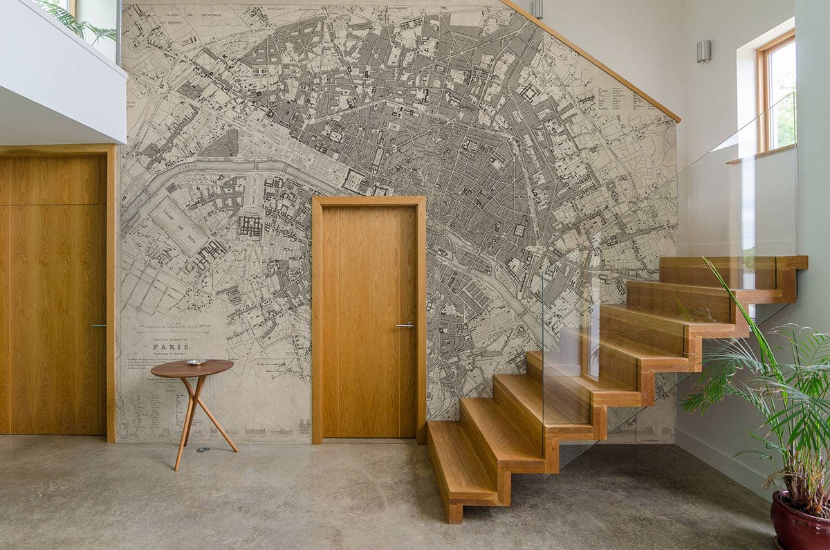 Elegant vintage Paris map mural wallpaper in monochrome historic style, featuring wooden staircase, modern decor.
