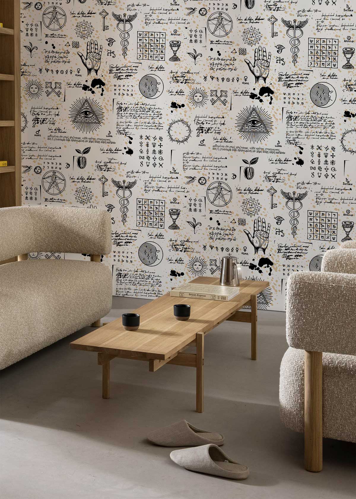 Mystical Vintage wallpaper featuring alchemy symbols, beige sofas, wooden coffee table in modern living room.