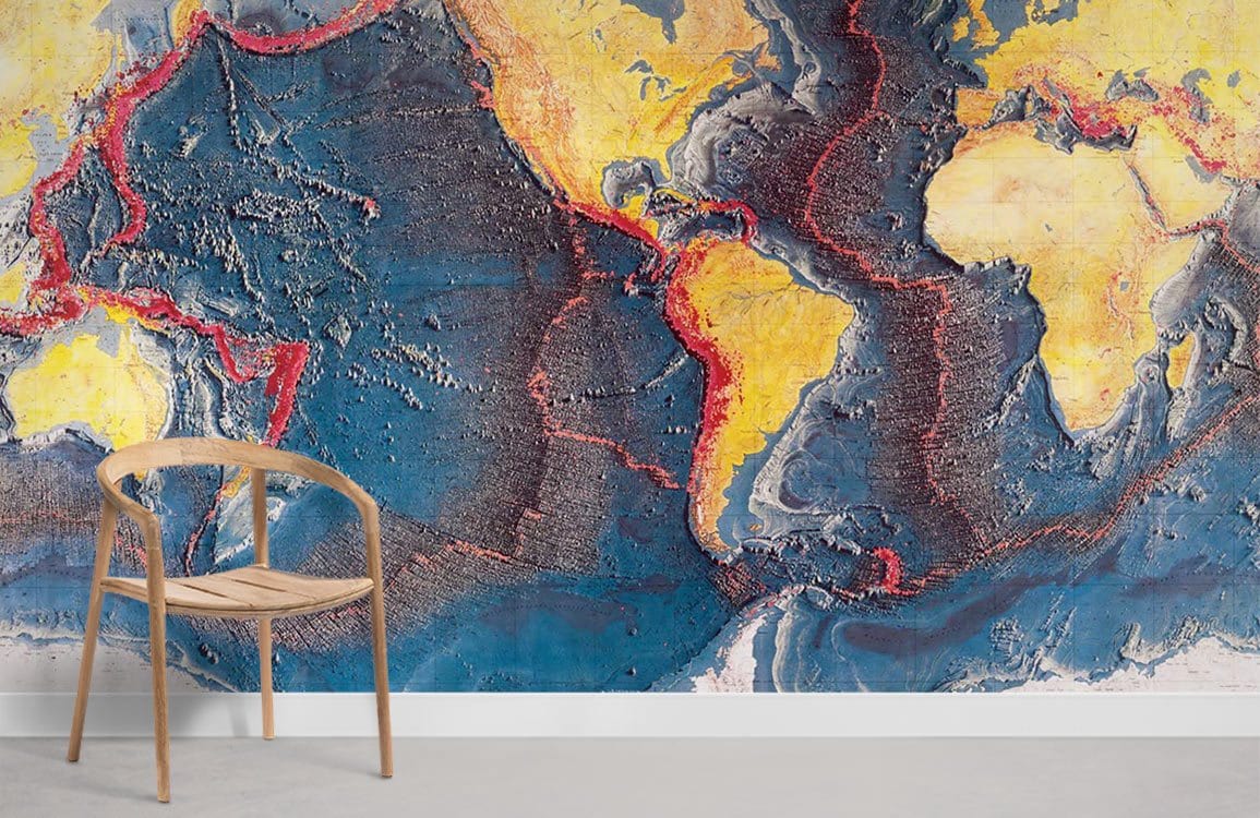 Vintage World Map Mural Wallpaper with vibrant oceanic colours, wooden chair, minimalist room, concrete flooring.