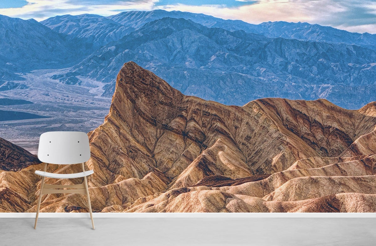 Desert Mountain Vista Mural: Earthy Tones Wallpaper, white modern chair, concrete flooring, scenic landscape backdrop.