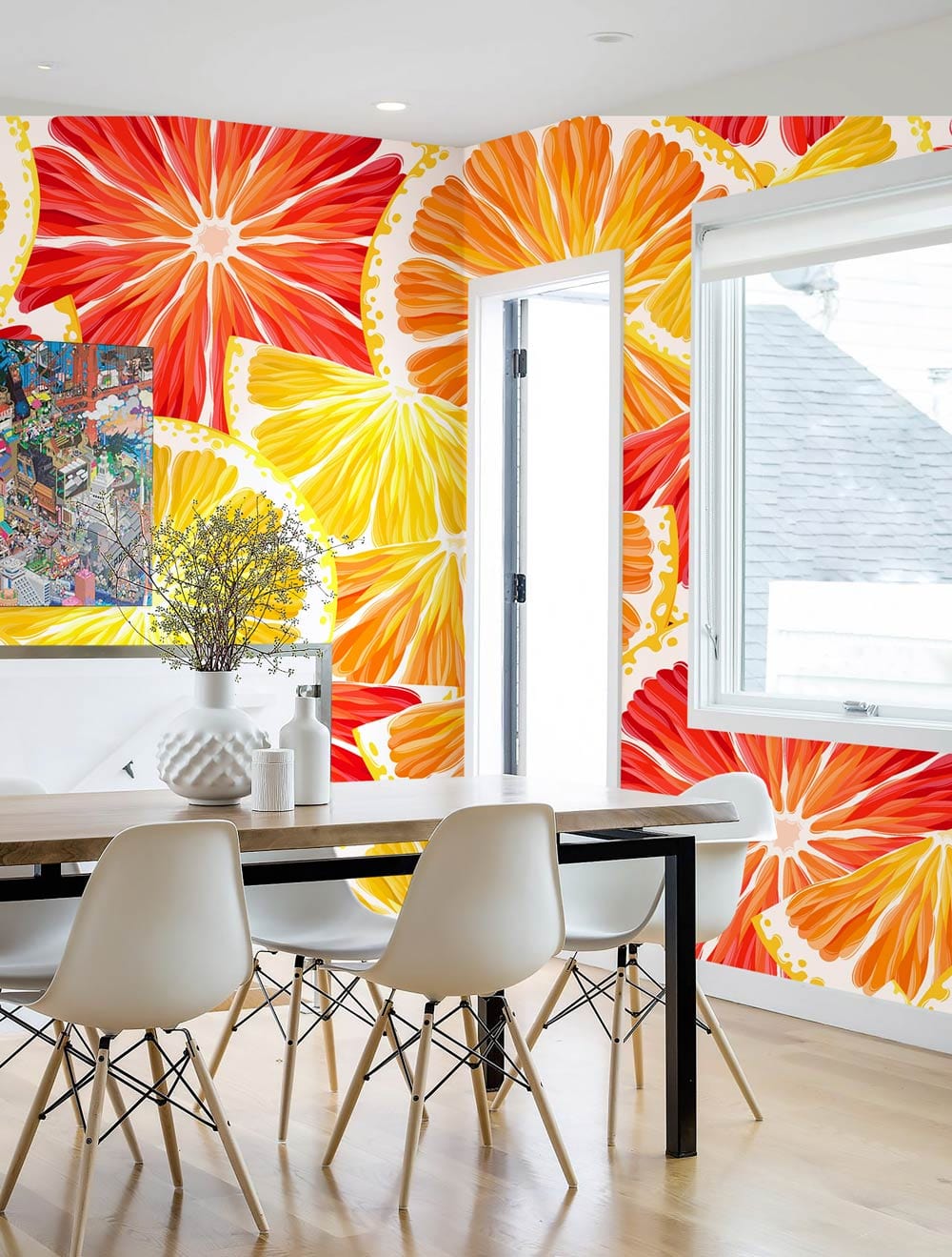 Dining room with Vibrant Citrus Splash Fruit Pattern Wallpaper, modern white chairs, light wood flooring.