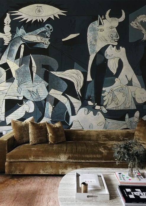 Velvet brown sofa with abstract mural on dark wall in modern living room, round white coffee table.