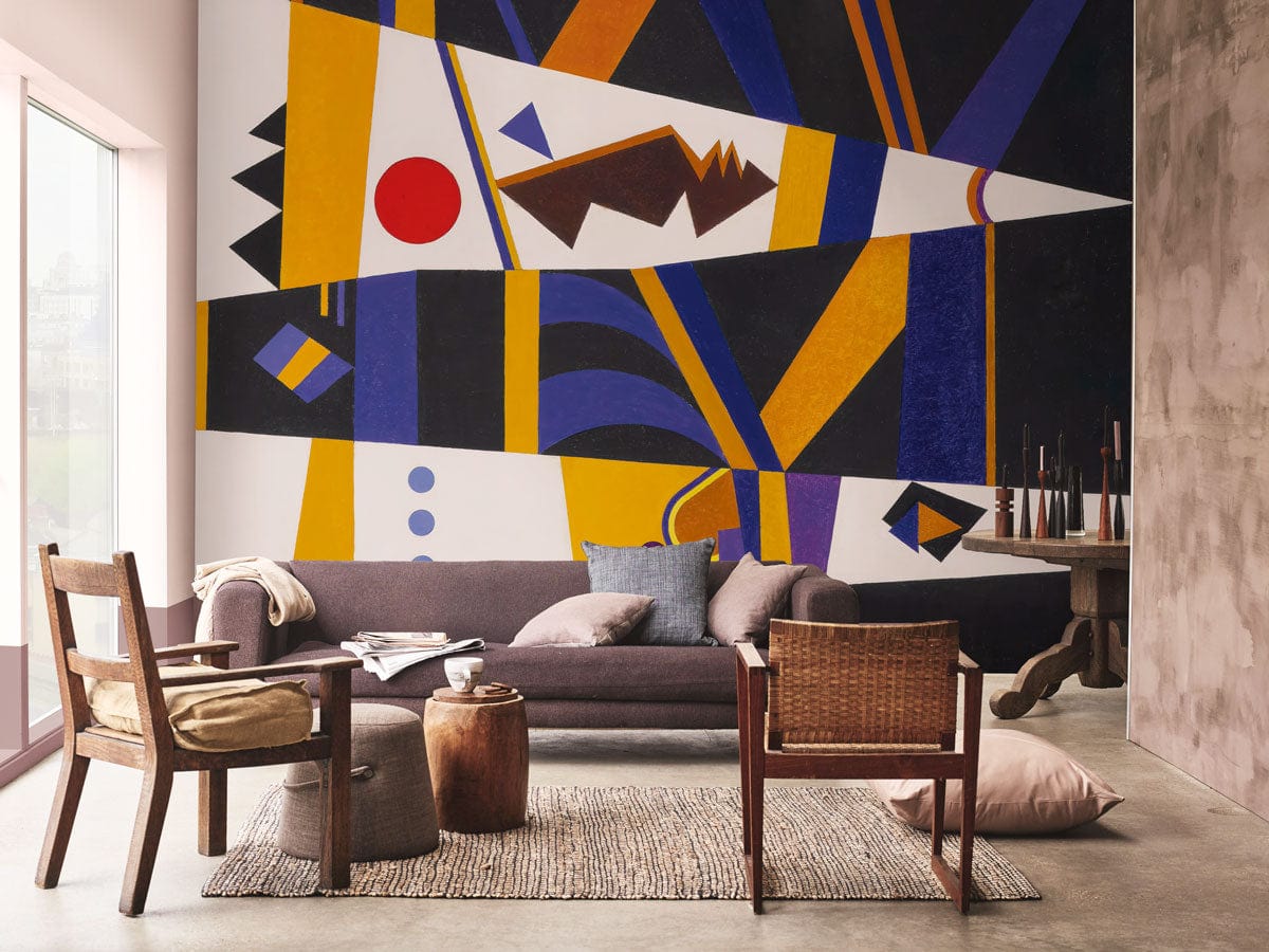 Modern lounge with geometric abstract wallpaper, brown sofa, wooden chairs, and concrete flooring. Bold wall art.