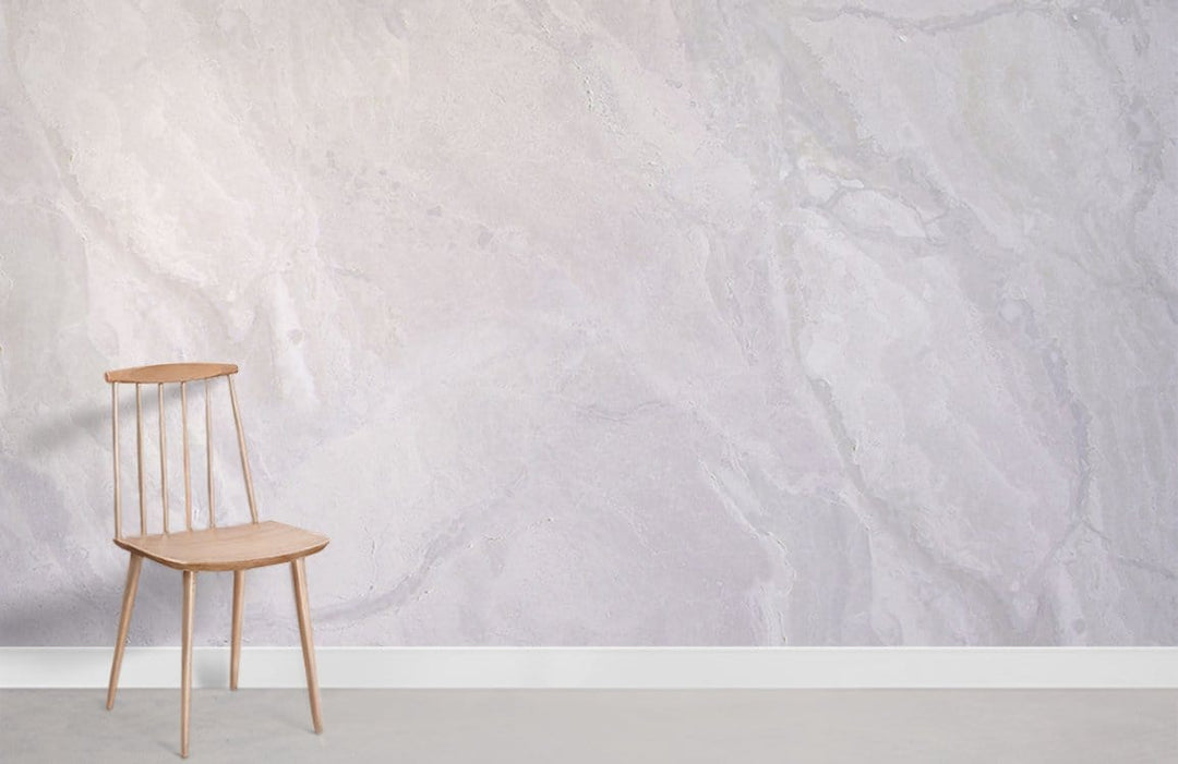 Elegant marble effect mural wallpaper with soft white tones, minimalist wooden chair, contemporary interior design.