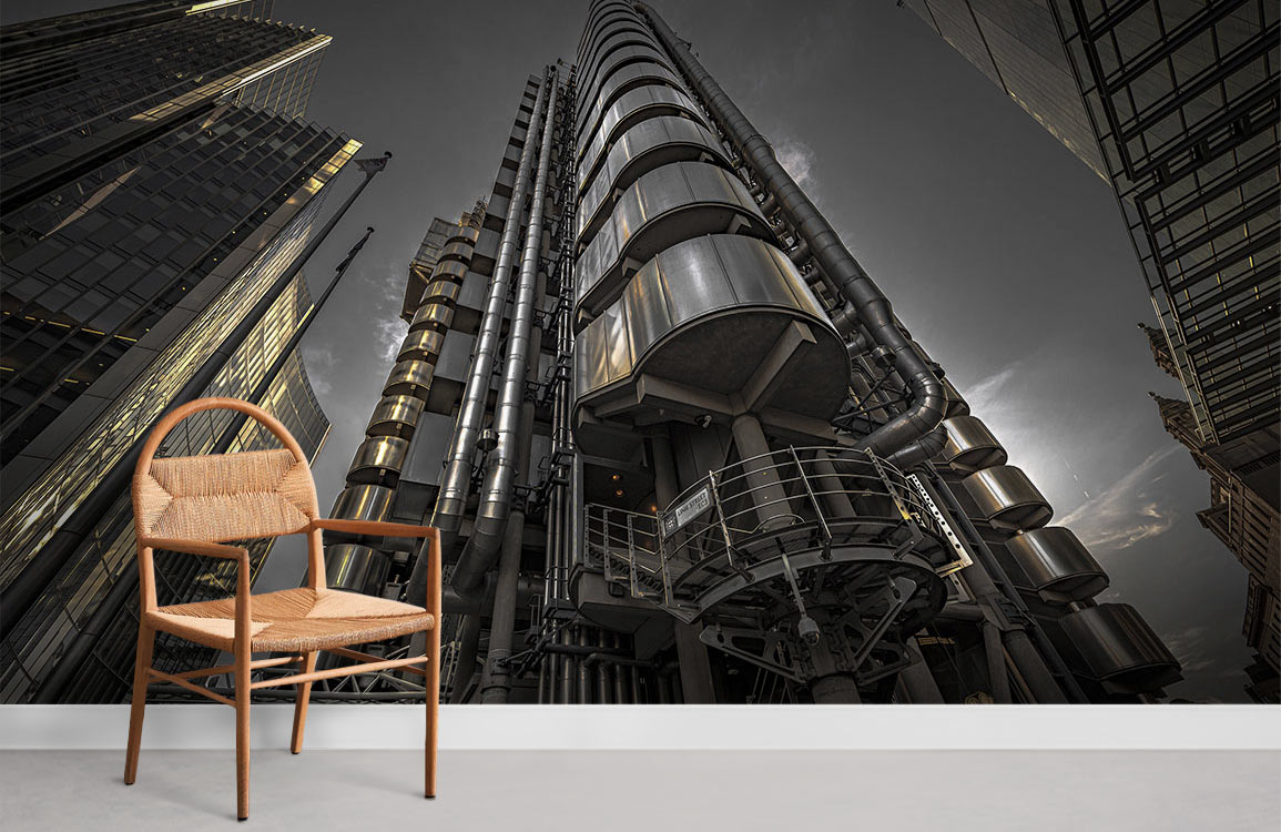 Modern Urban Skyscraper Mural Wallpaper in dark steel tones, featuring wooden chair and grey flooring.