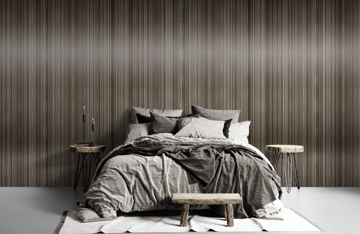 Elegant bronze stripe wallpaper in modern bedroom with grey bedding, wooden tables, and grey flooring.