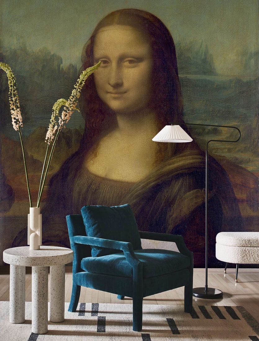 Classic Renaissance mural wallpaper, teal velvet armchair, modern lamp, round table, wooden flooring, earthy tones.
