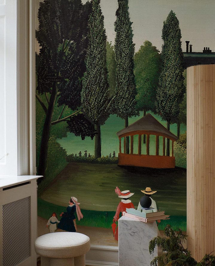 Elegant Victorian garden mural wallpaper, featuring lush trees, classic design, cosy stool, and marble side table.