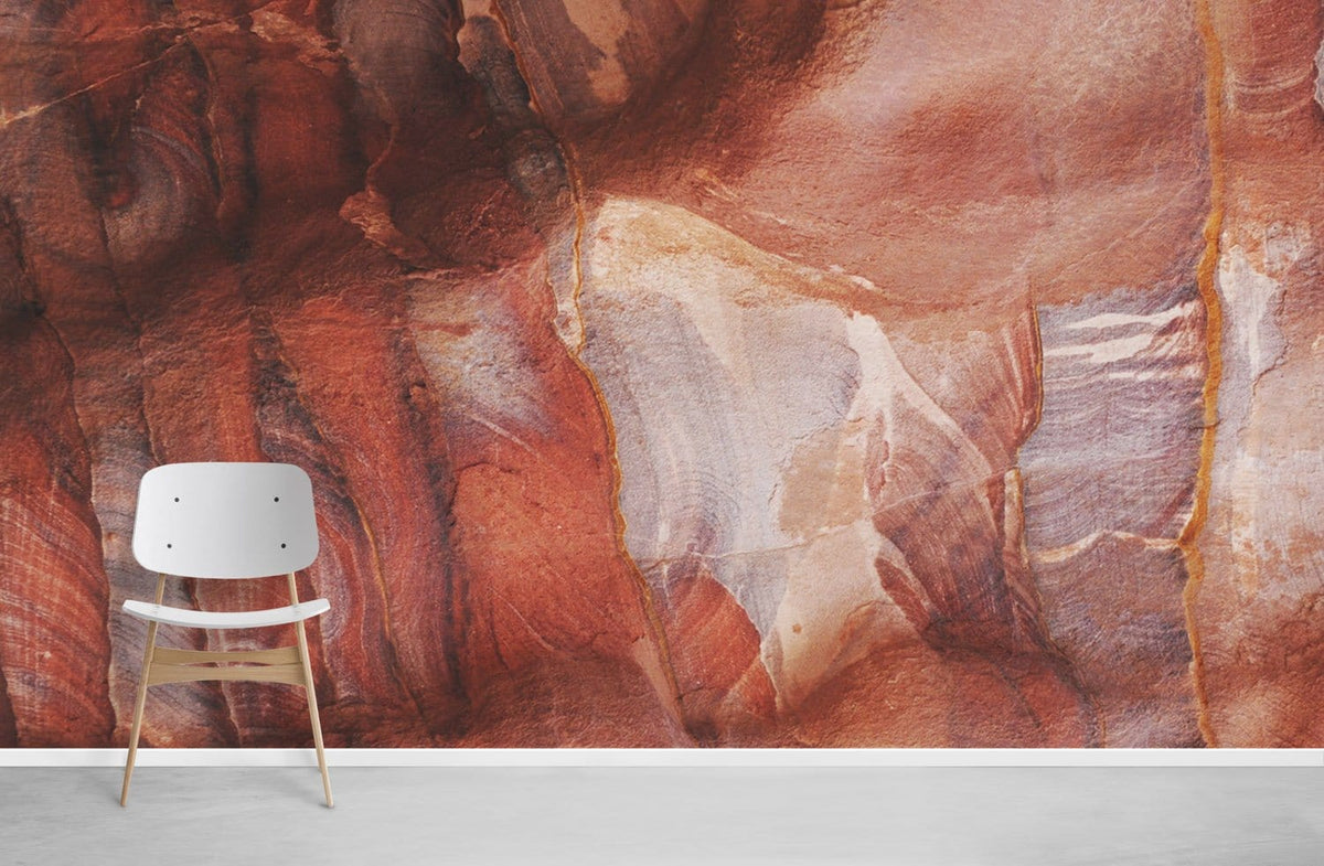 Rustic terracotta abstract stone texture mural wallpaper with white chair on grey flooring, bold interiors.