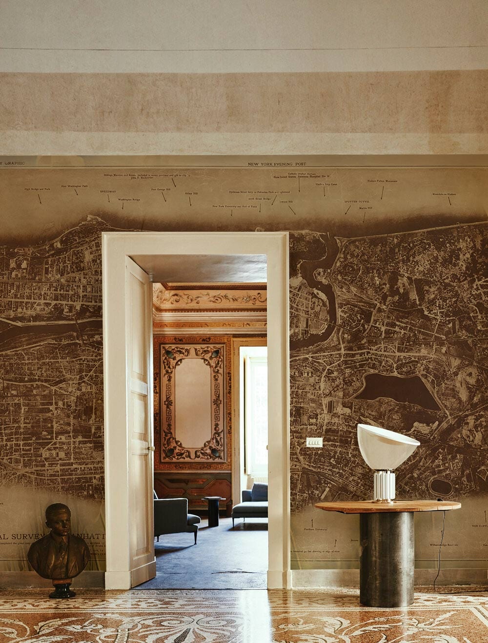 Vintage sepia New York City map mural wallpaper in elegant room with ornate flooring, stylish decor.