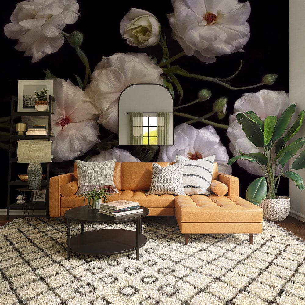 Elegant cream floral mural wallpaper, orange sofa, patterned rug, modern coffee table, green plant, contemporary room.