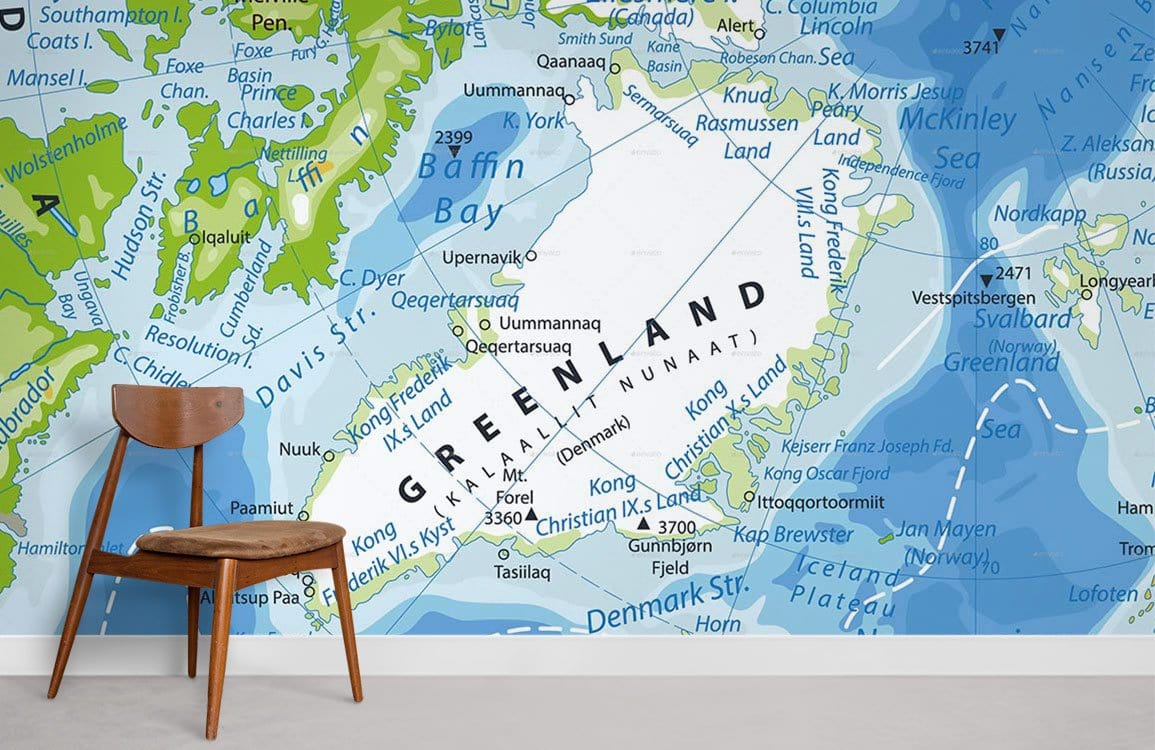 Colourful Greenland map mural wallpaper in modern interior with wooden chair and light grey flooring.