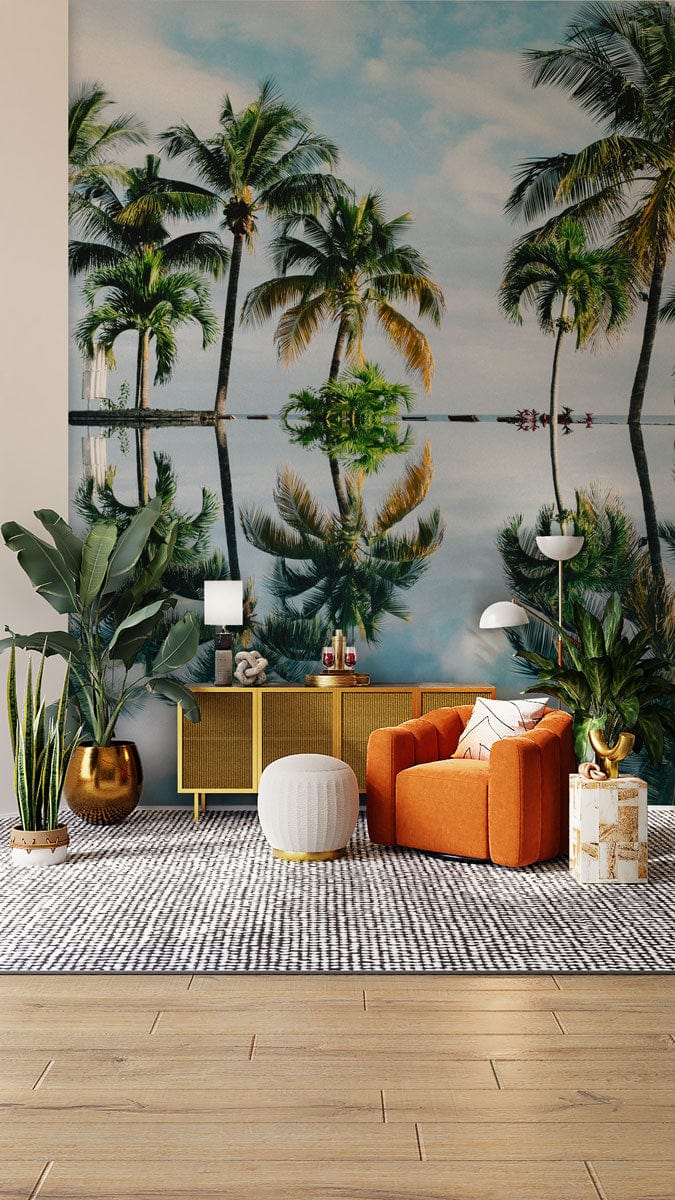 Tropical palm tree mural wallpaper with orange armchair, modern sideboard, grey rug, wooden flooring.