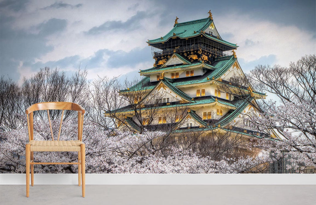 Serene Japanese Castle mural, cherry blossoms, wooden chair, grey flooring, wall art featuring scenic landscape.
