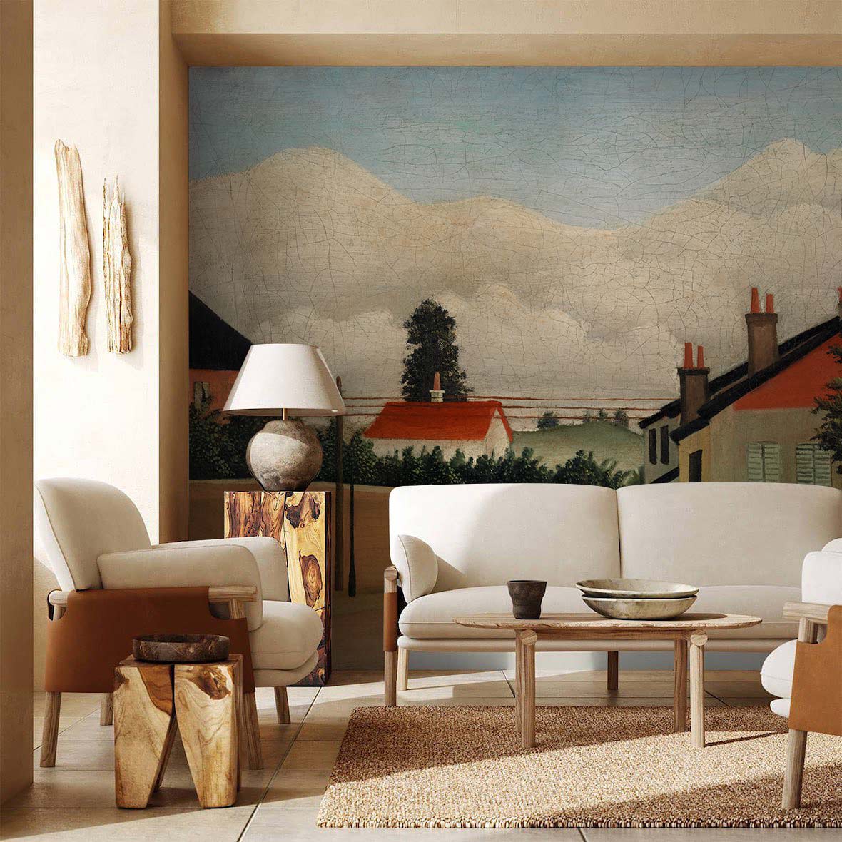 Vintage village scene mural wallpaper in red tones, earth-tone sofas, wooden coffee table, beige tiles.