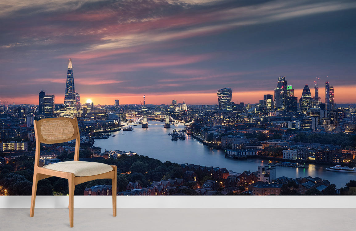 Nighttime London Skyline Mural Wallpaper in modern room with wooden chair, white walls, grey flooring.