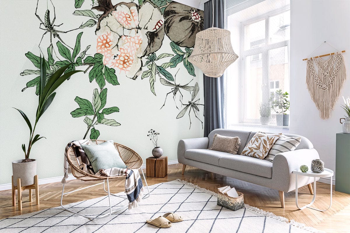 Botanical Pomegranate wallpaper in living room with grey sofa, wicker chair, wooden flooring, and decor.