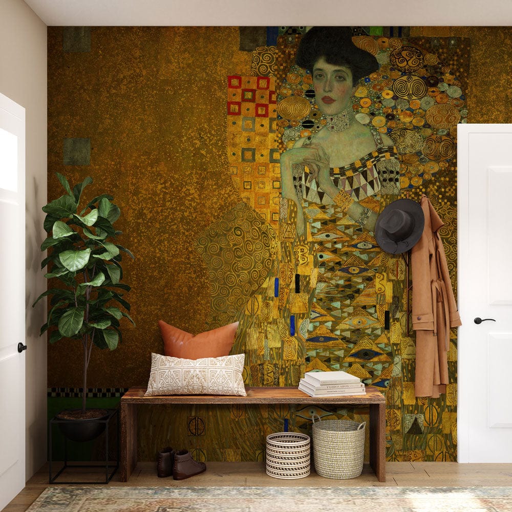Luxurious Art Nouveau golden mural wallpaper in lounge with wooden bench, cushions, plants, and hat.