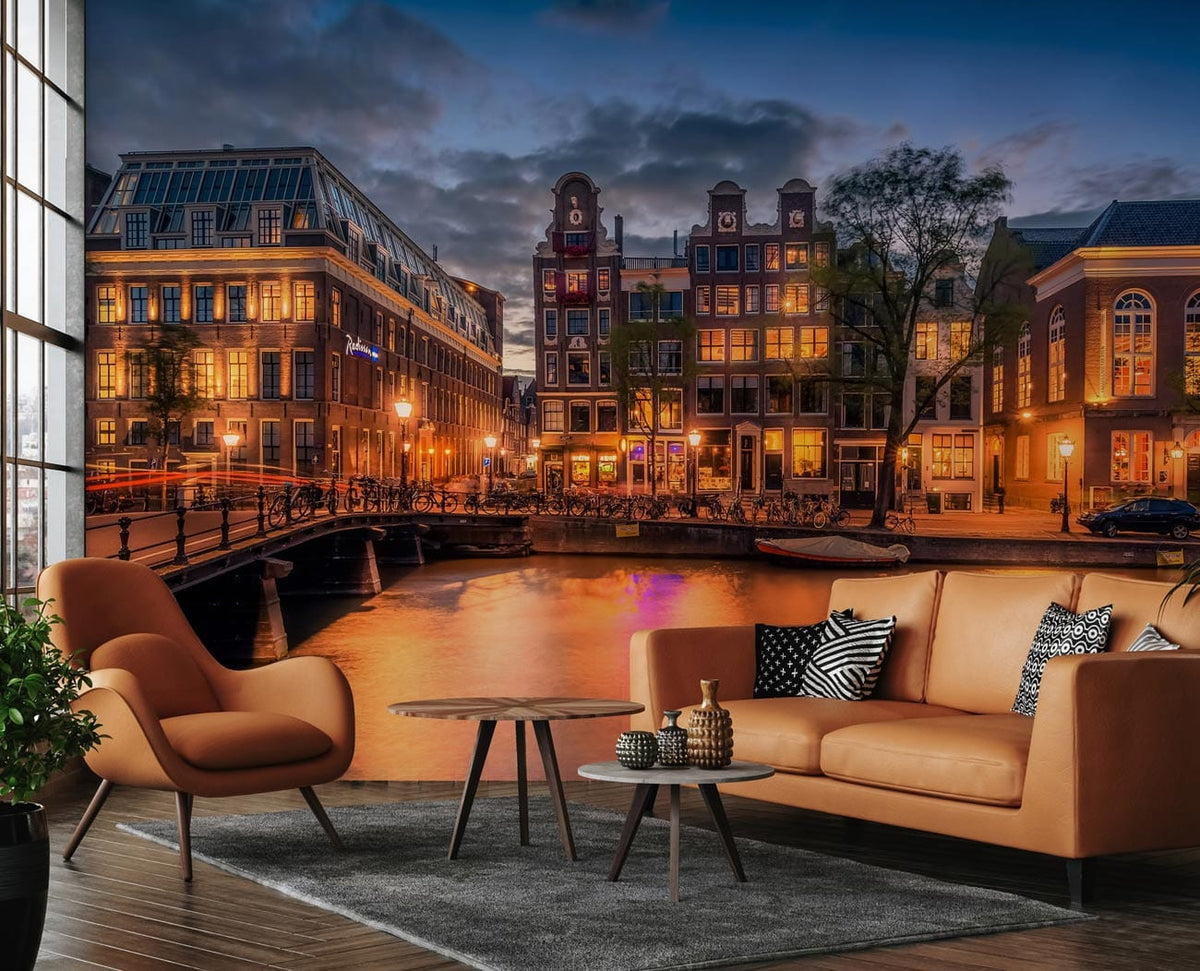 Enchanting Amsterdam Canal View mural; evening glow; brown leather sofa; modern chairs; wooden flooring.