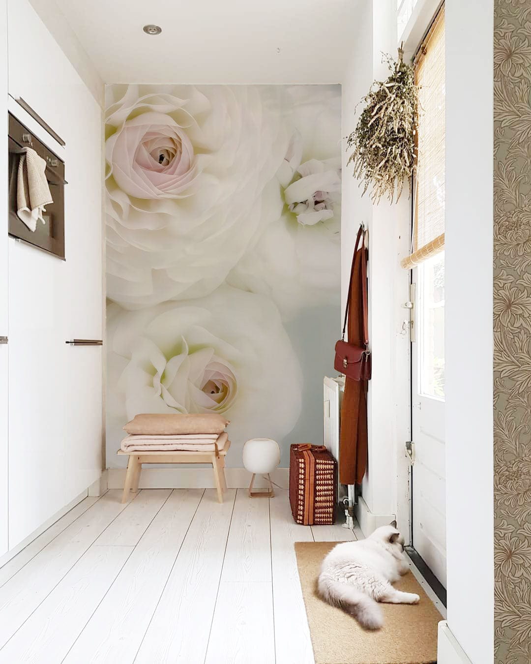 Elegant White Blossom Mural Wallpaper in minimalist hallway with wooden flooring and white cabinetry.