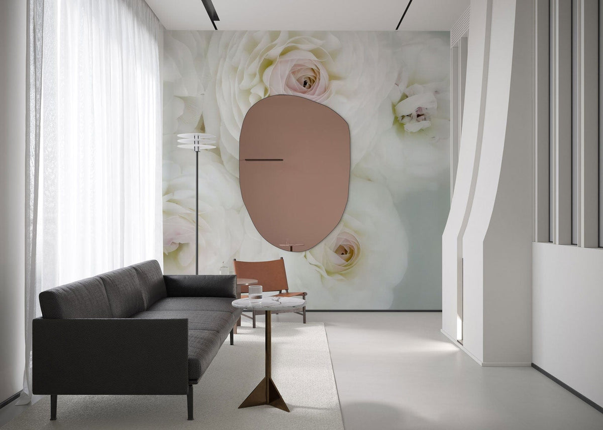 Elegant white blossom mural wallpaper in modern lounge with dark sofa, minimalist table, contemporary flooring.
