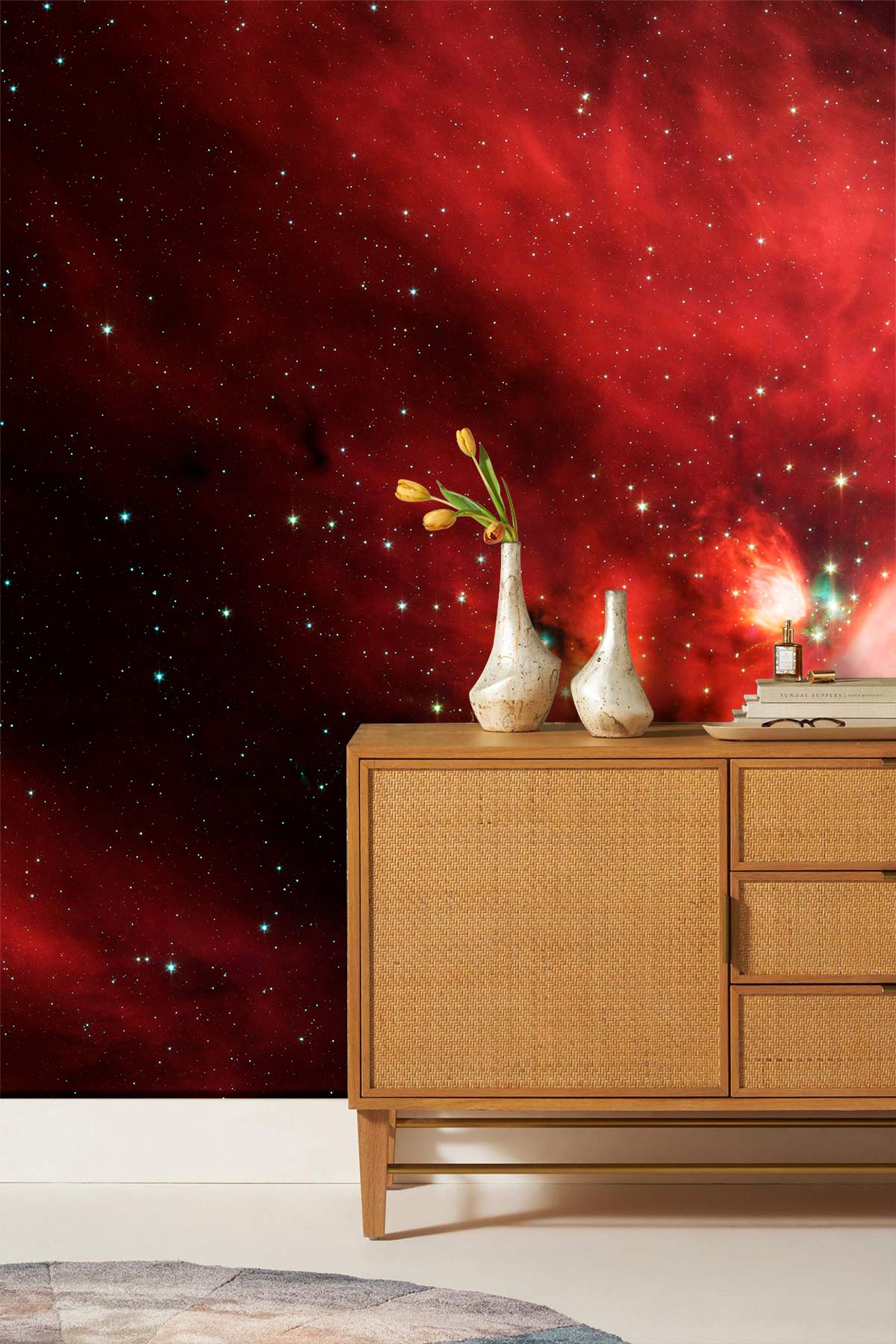 Ethereal Cosmic Nebula Wallpaper in red, with beige mid-century sideboard and neutral patterned rug.