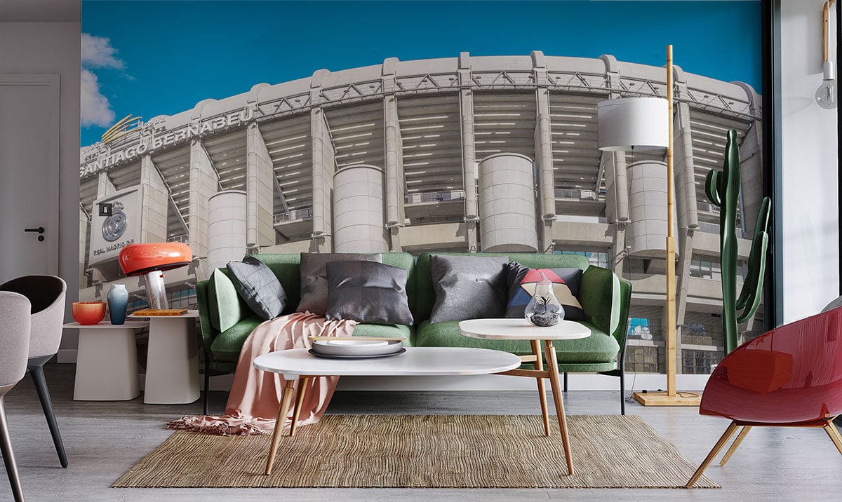 Vintage Santiago Bernabéu Stadium mural wallpaper with modern sofa, sleek floor lamp, and minimalist furniture.