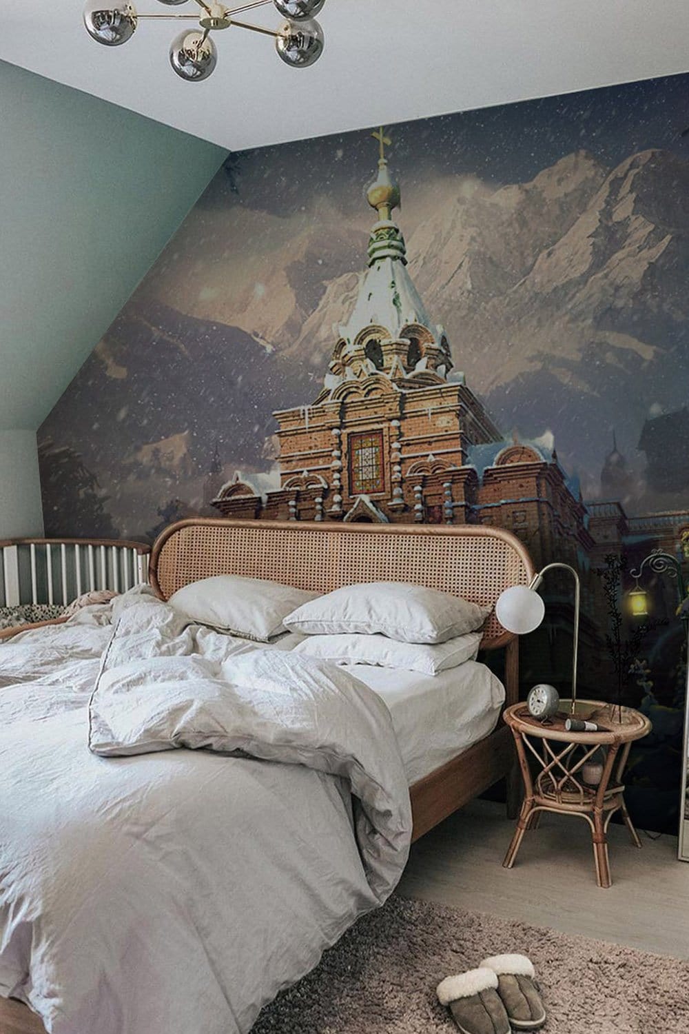 Bedroom with Winter Wonderland Snowy Castle Mural Wallpaper, rattan bed, grey walls, grey bedding, wooden floor.