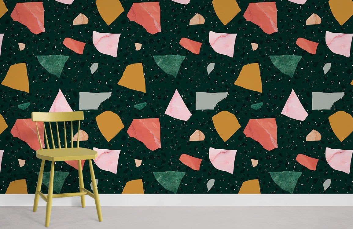 Abstract multicolour geometric terrazzo wallpaper with green chair and light grey flooring in modern room.