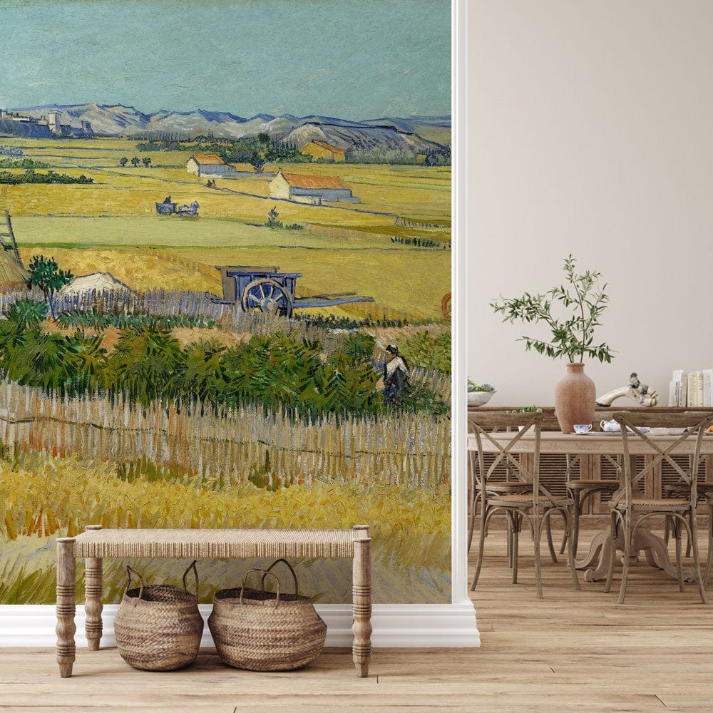 Classic Impressionist countryside mural wallpaper with natural wood dining furniture and neutral wall backdrop.