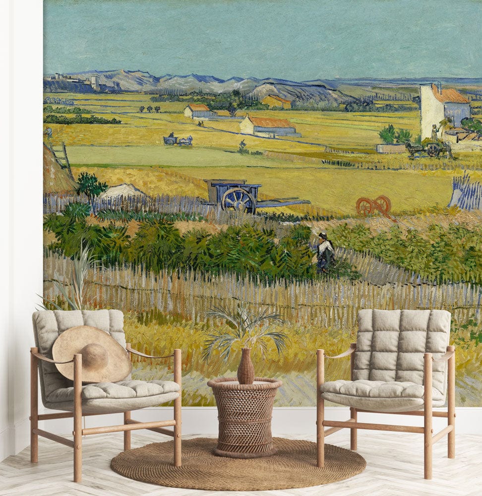 Idyllic Countryside Landscape Mural Wallpaper with cosy armchairs and round woven rug in living room.