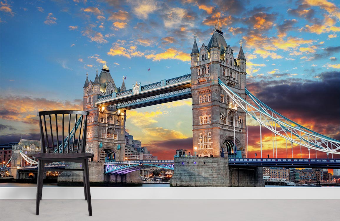 Chair by vibrant London Tower Bridge sunset mural wallpaper in minimalist room with white floor.