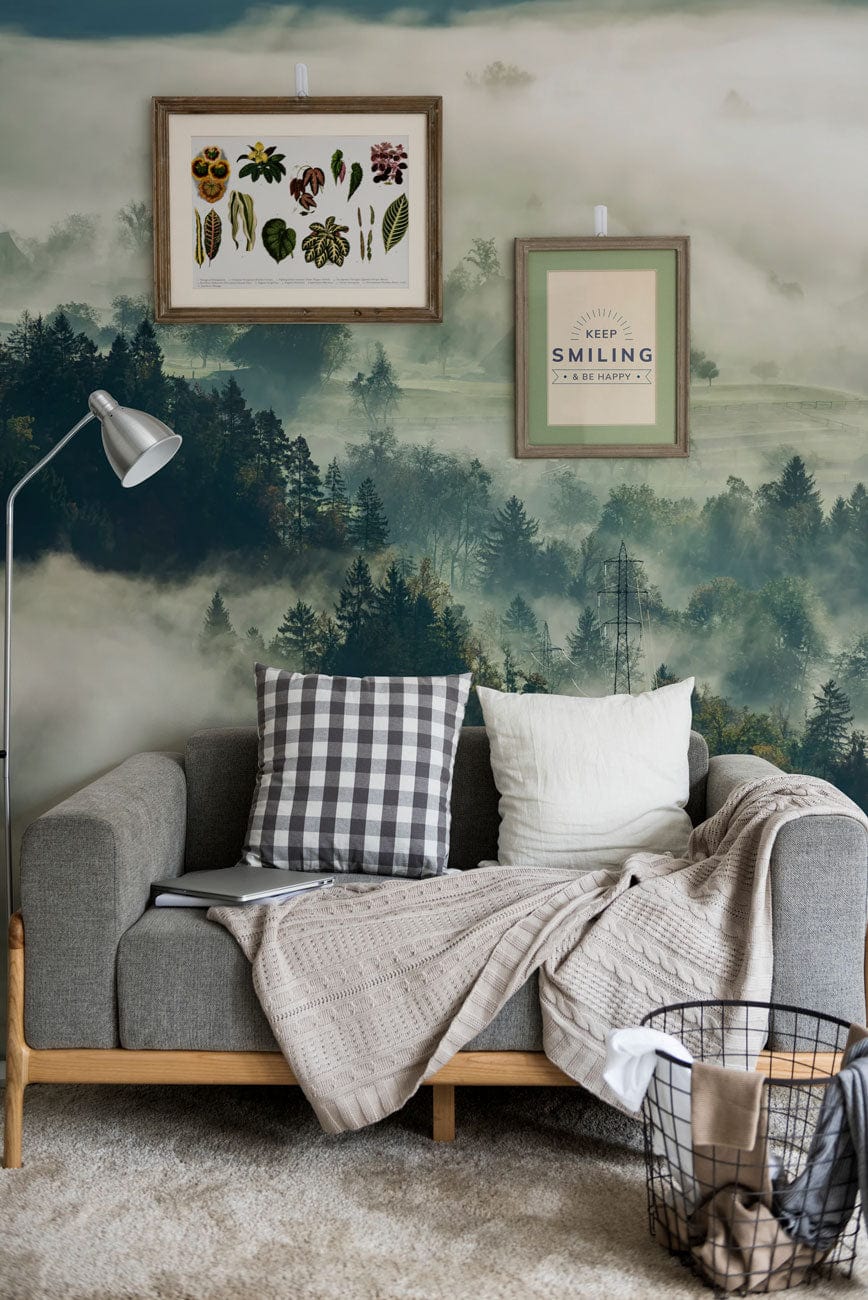 Mist-covered forest mural wallpaper; earthy tones, grey sofa, cosy living room Décor, framed wall art.