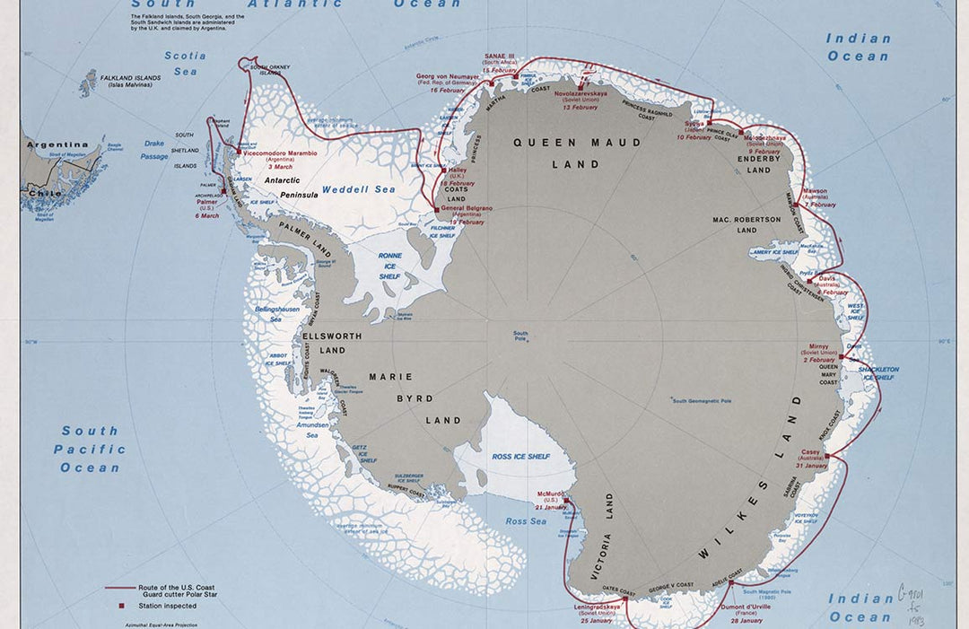 Vintage Antarctic Map Mural Wallpaper in Soft Earth Tones and Blue.