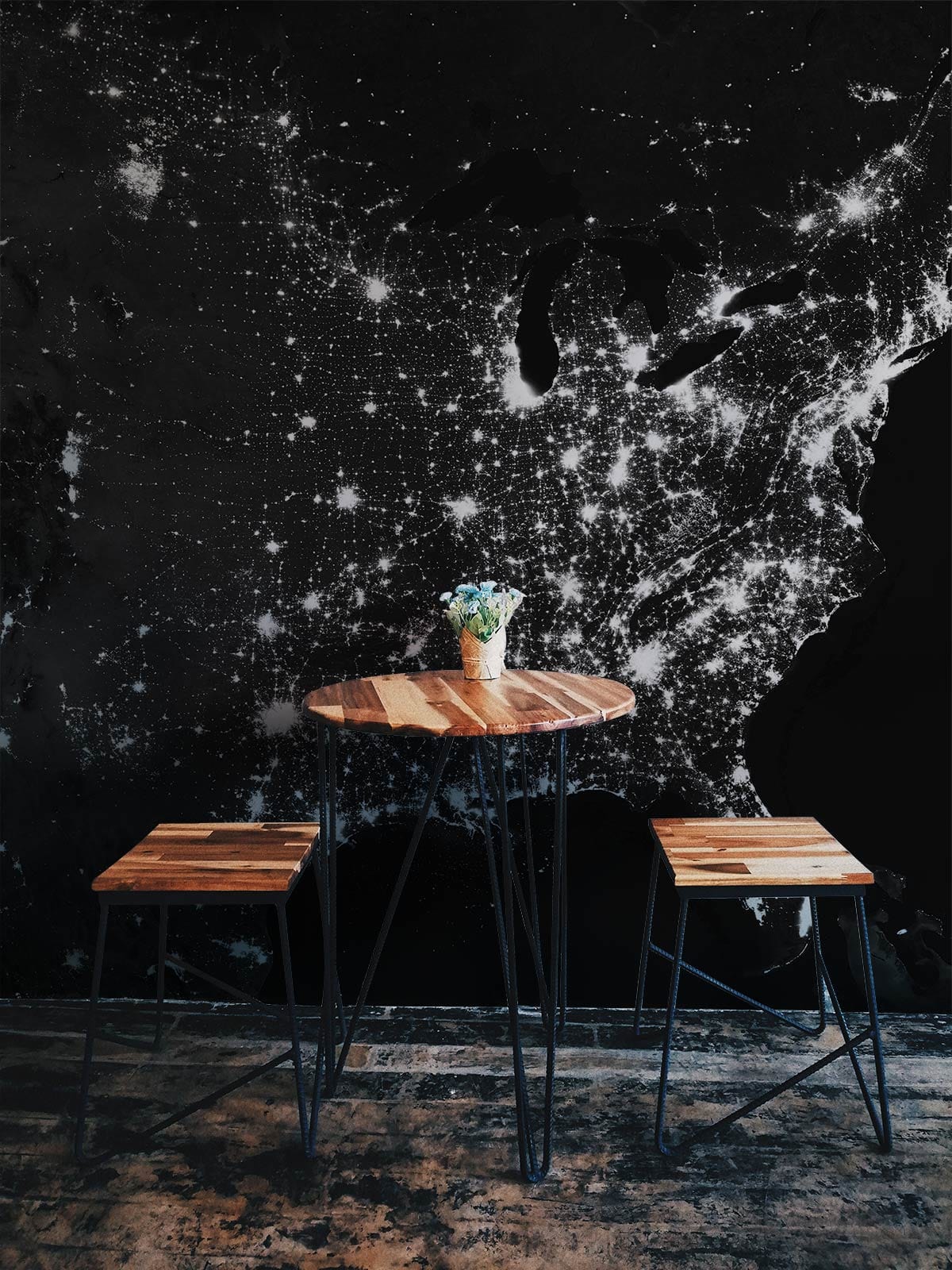 Starry Night Urban Lights Wallpaper with wooden stools, rustic table, and industrial flooring in dining room.