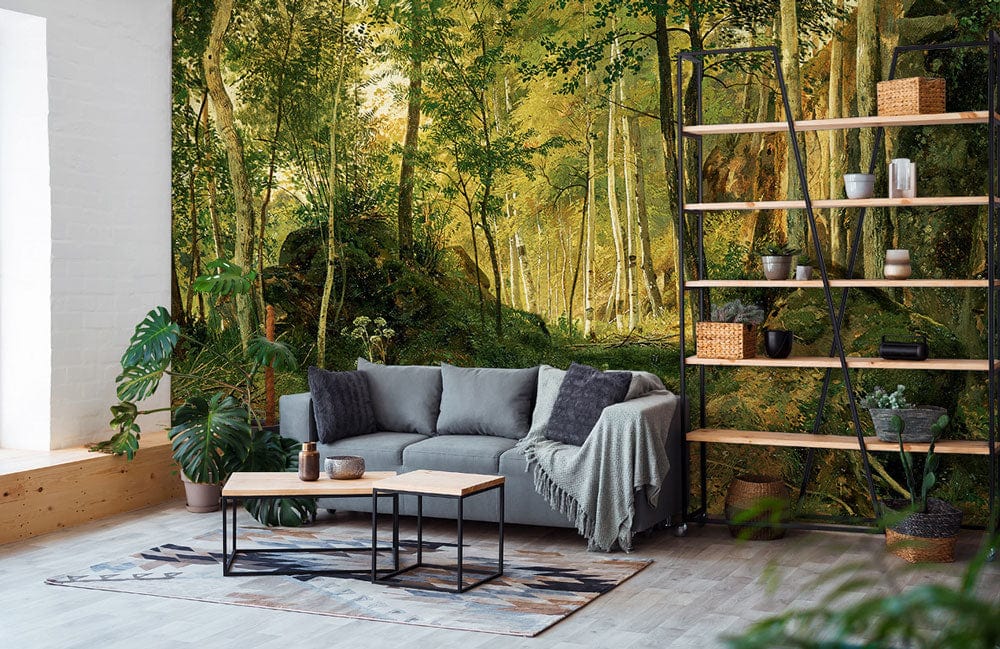 Serene Birch Forest Mural Wallpaper on living room wall, green landscape style, grey sofa, wooden flooring.