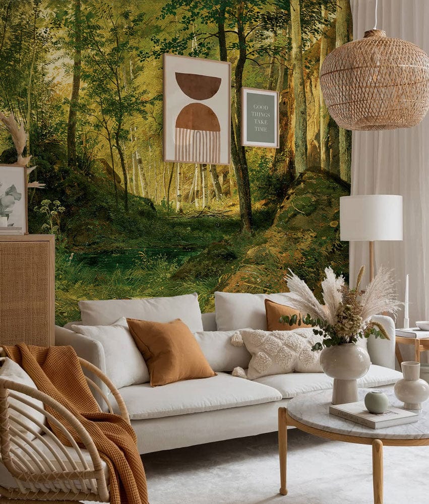 Cosy lounge with Serene Birch Forest Mural Wallpaper, white sofa, wicker chair, and wooden flooring.