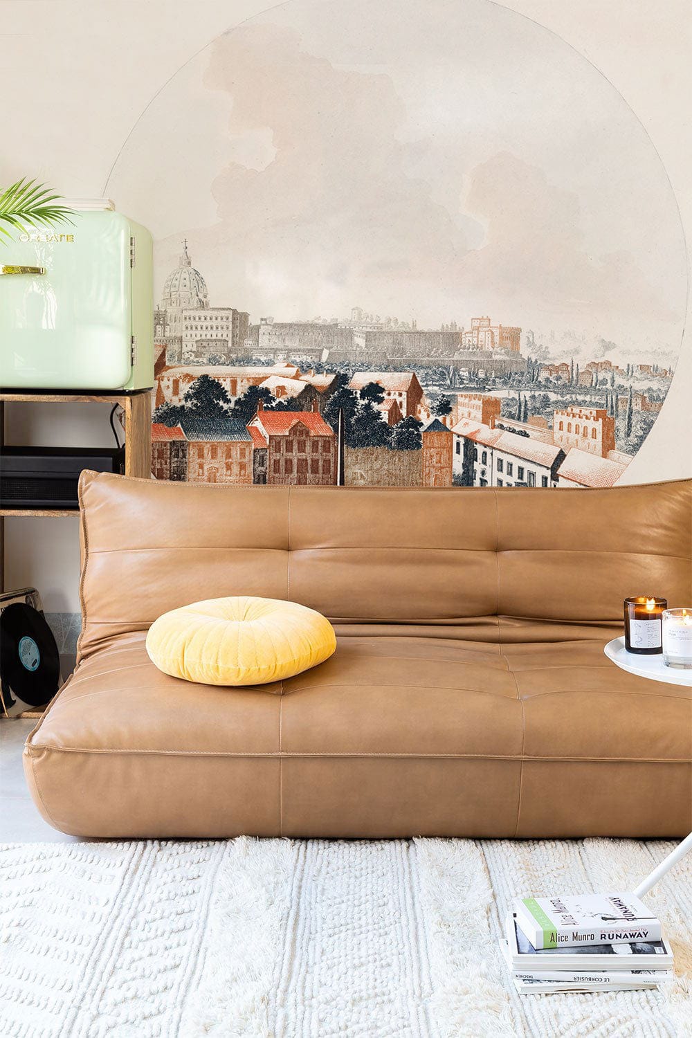 Historic Cityscape Mural Wallpaper with Tan Sofa, Cream Rug, Vintage Fridge in Cosy Living Room.