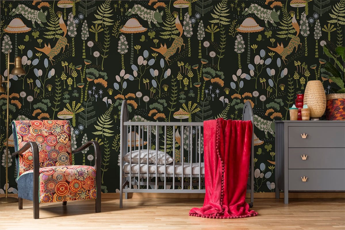 Alt text: Woodland Forest Charm wallpaper in nursery with grey cot, colourful armchair, grey dresser, wooden flooring.
