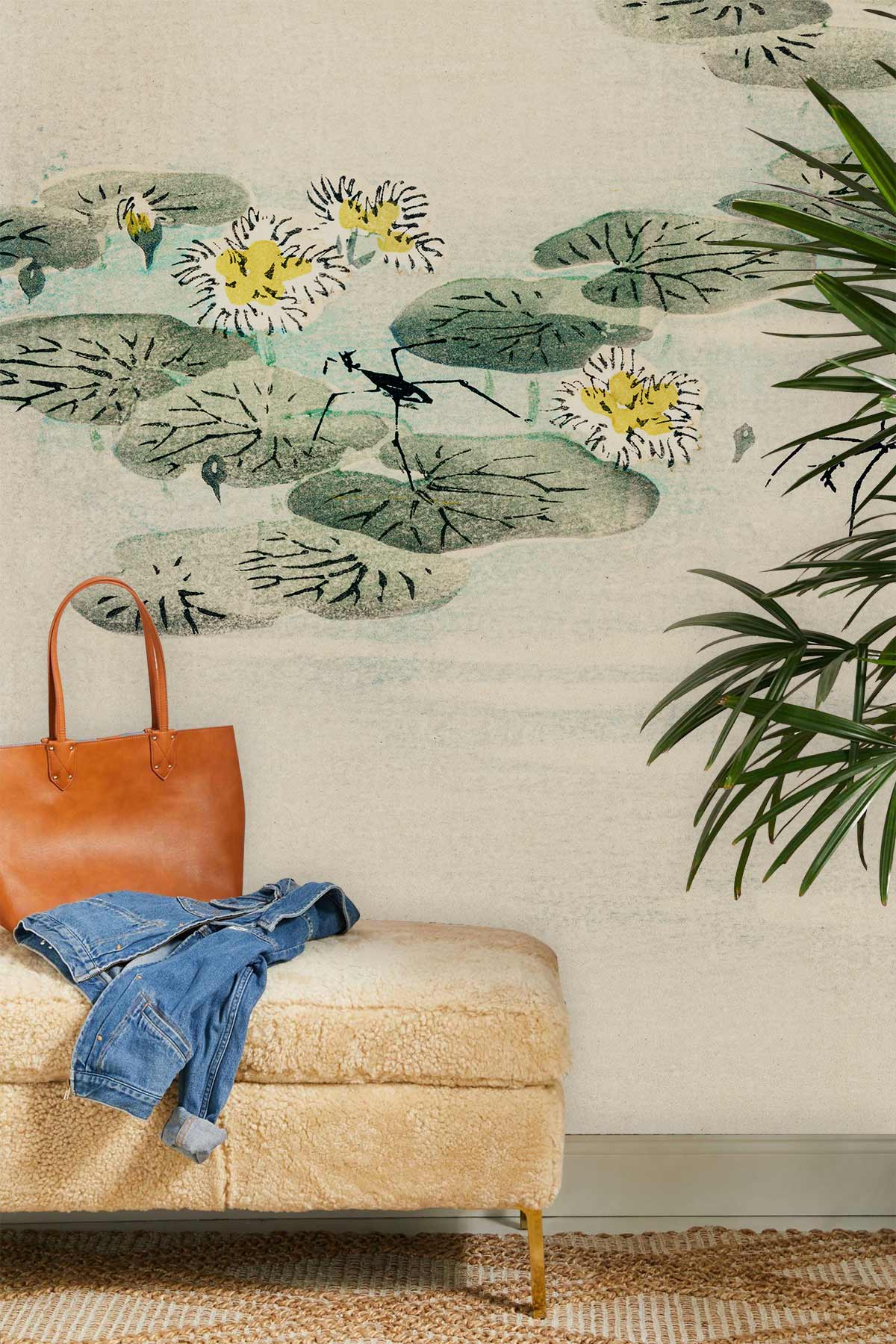 Elegant lounge featuring Tranquil Water Lilies mural wallpaper, plush beige bench, and leafy decor.