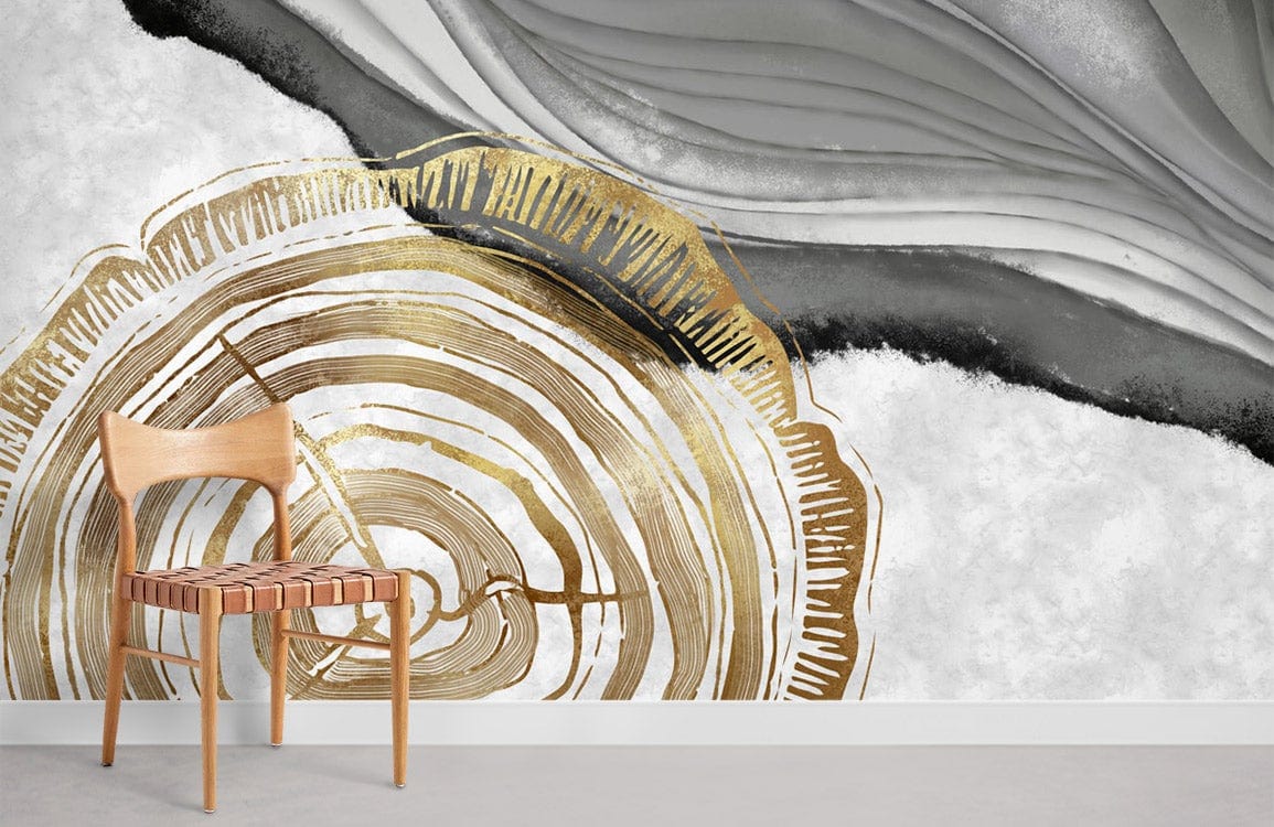 Elegant gold and grey mural wallpaper with nature-inspired design, featuring a modern wooden chair.