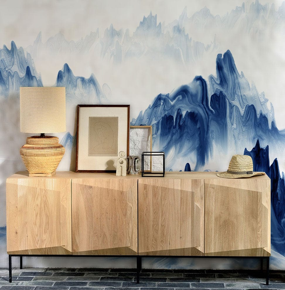 Serene Blue Mountain Mist Mural Wallpaper in room with wooden sideboard on stone flooring.