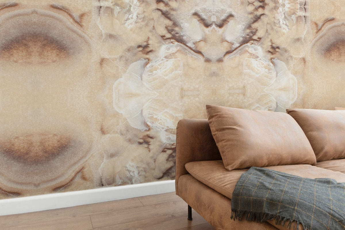 Elegant beige marble effect mural wallpaper in living room with brown suede sofa and wood flooring.