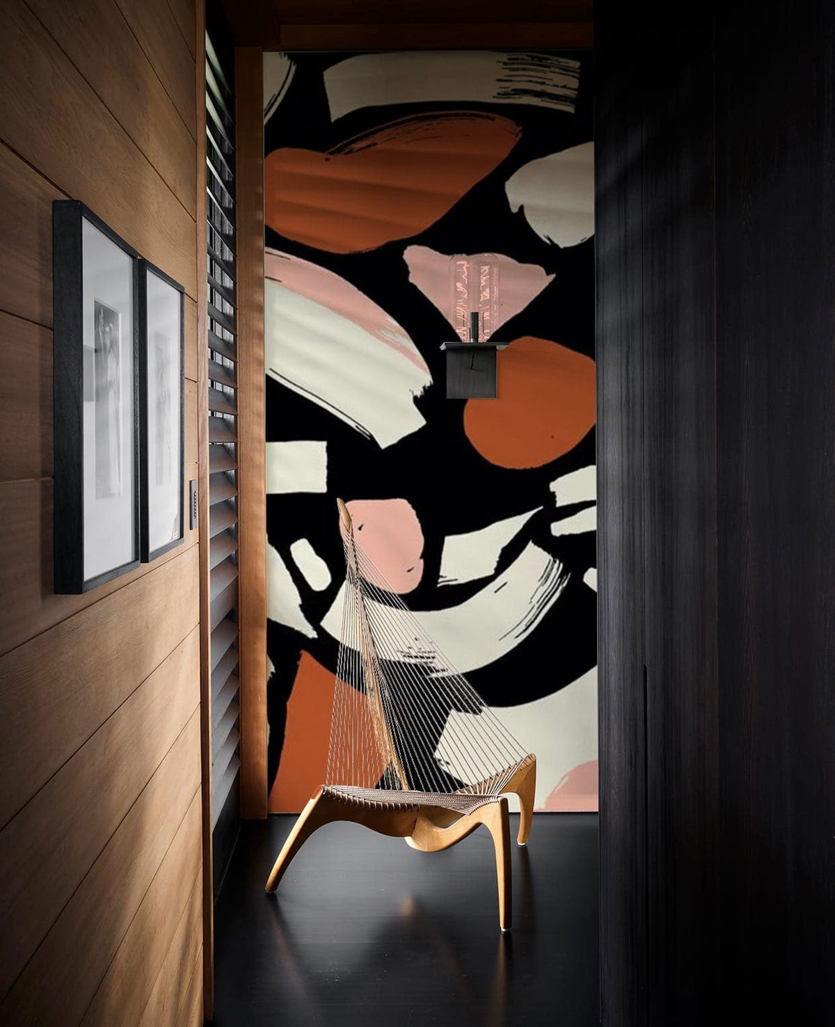Abstract Geometric Wallpaper in modern hallway with wooden walls, sleek black flooring, and artistic chair.
