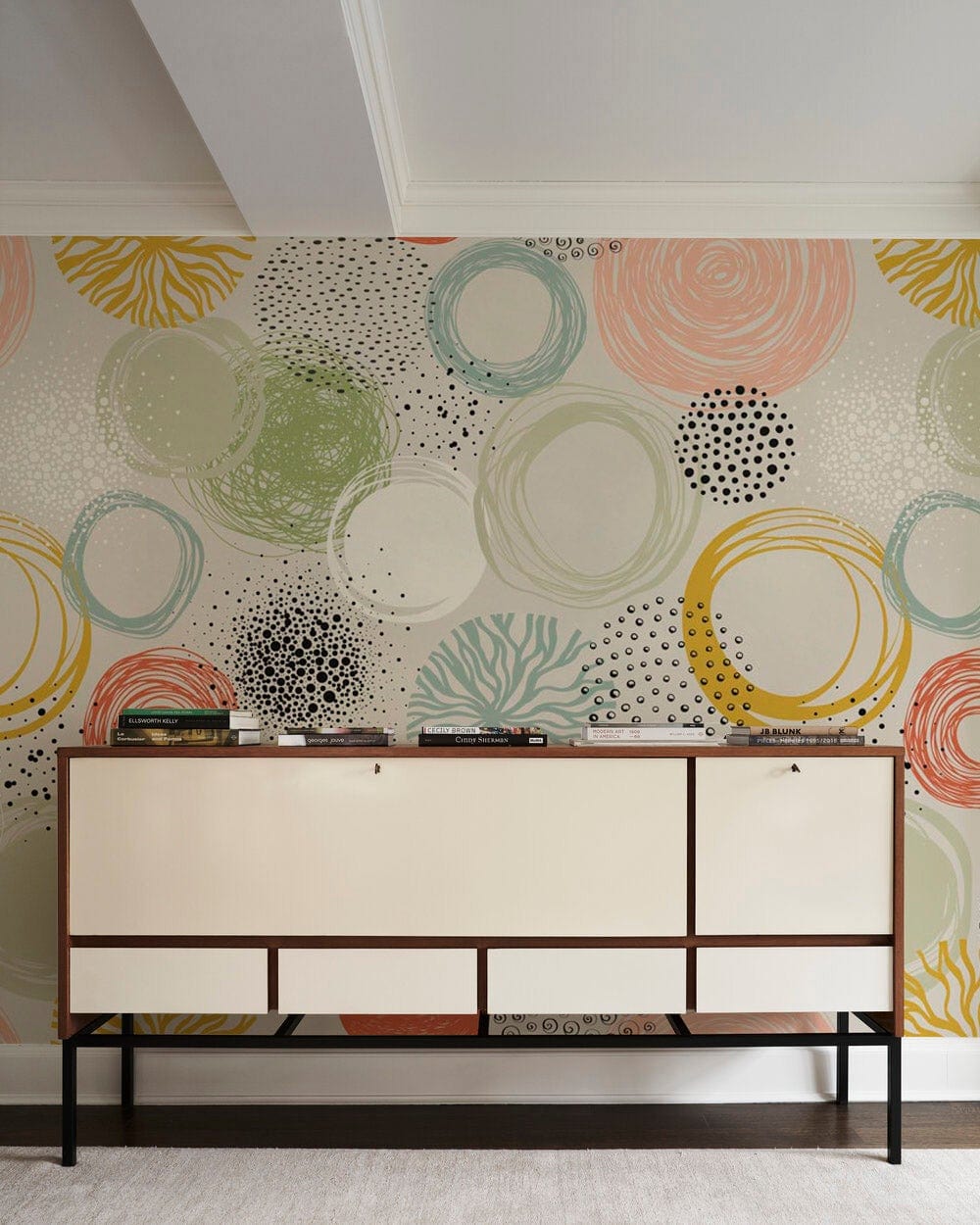 Abstract Pastel Circles Patterned Wallpaper, earthy tones, modern sideboard, neutral carpet, living room decor.