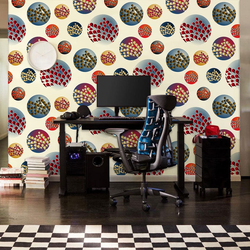 Retro circular motif wallpaper in home office with checkered flooring and modern black desk setup.