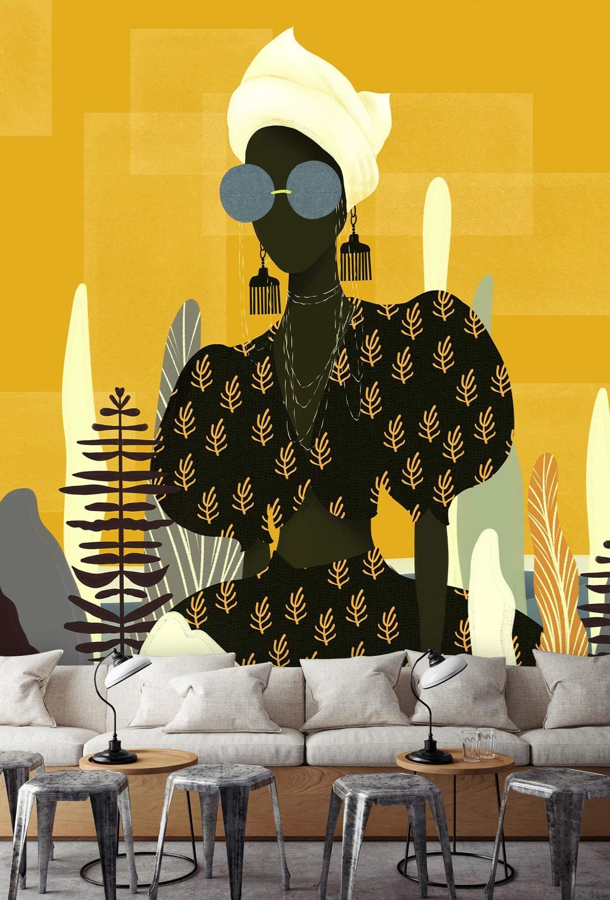 Chic abstract art wallpaper, bold yellow earthy tones; modern sofa, industrial stools in living room.