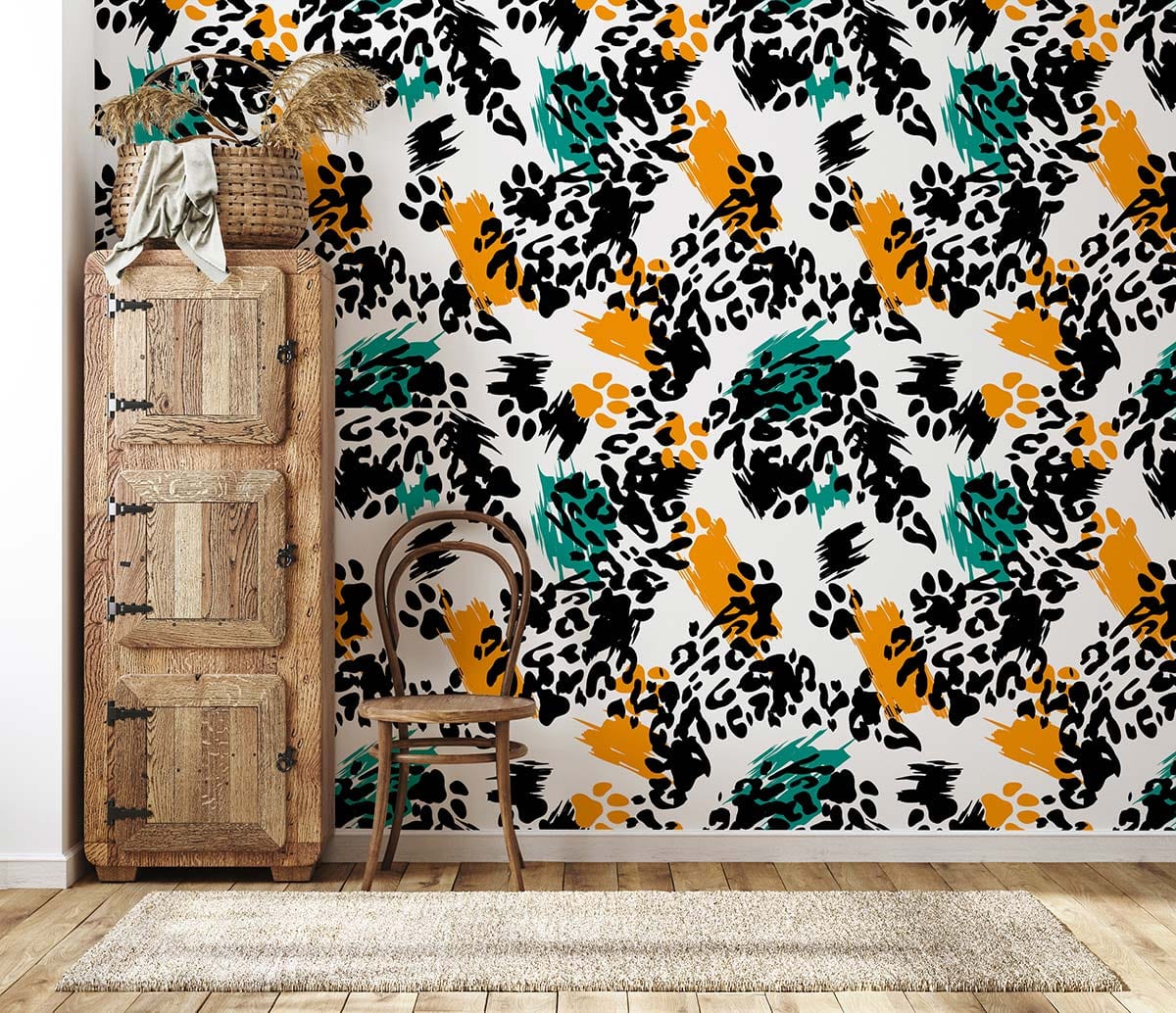 Bold abstract brushstroke wallpaper in black, orange, and green; rustic wooden cabinet; hardwood flooring.