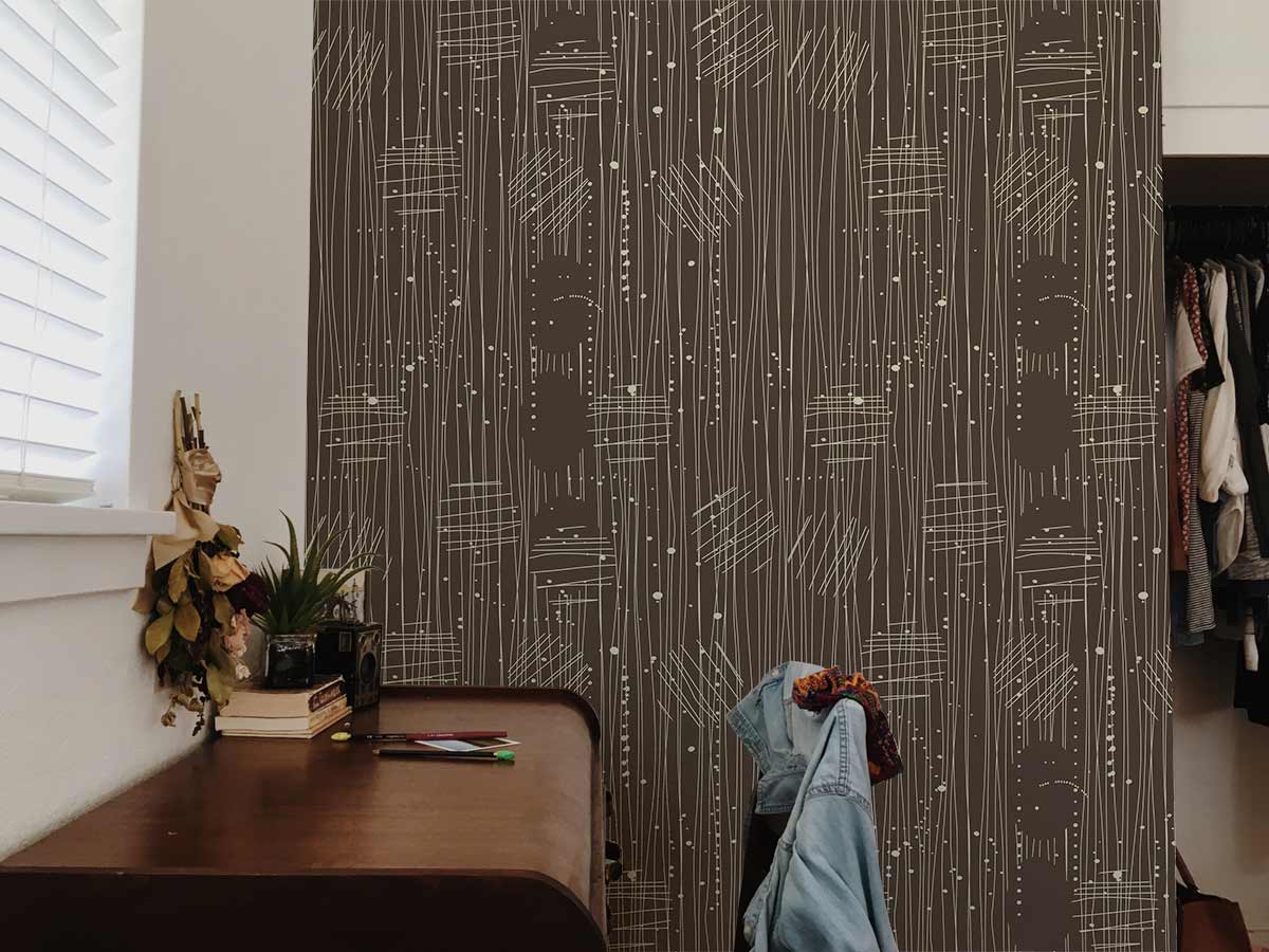 Abstract Earthy Tones Line Pattern Wallpaper in bedroom with wooden desk, white walls, and closet space.