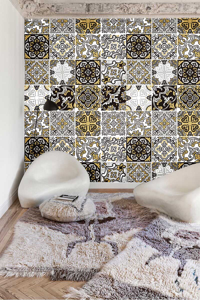 Vintage Moroccan Tile Pattern Wallpaper in Gold and Black, modern chairs, wooden flooring, textured rug.